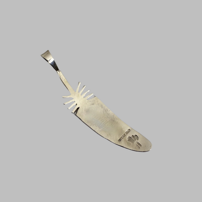 Hopi Sunface and Feather Silver Overlay Pendant, by Willis Humeyestewa