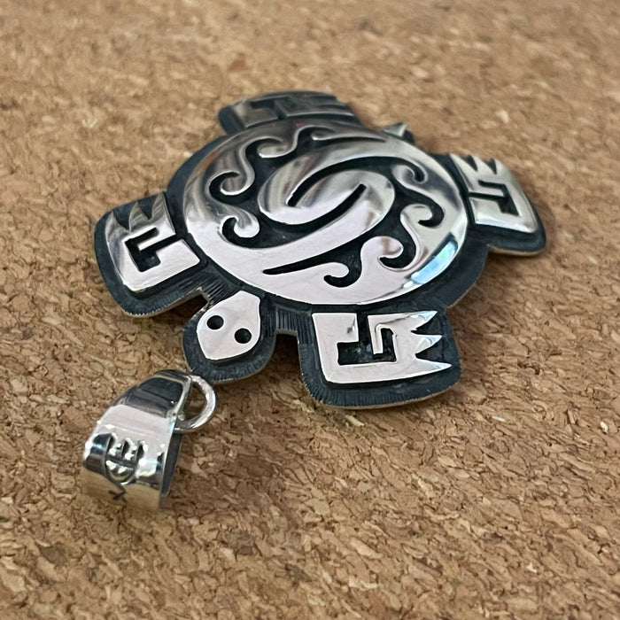 Turtle and Storm Hopi Silver Pendant, by Ruben Saufkie