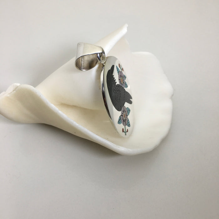 Inlaid Raven Silver Pendant, by Nancy and Ruddell Laconsello
