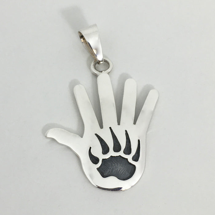 Hopi Silver Overlay Hand and Bear Paw Pendant, by Merle Namoki