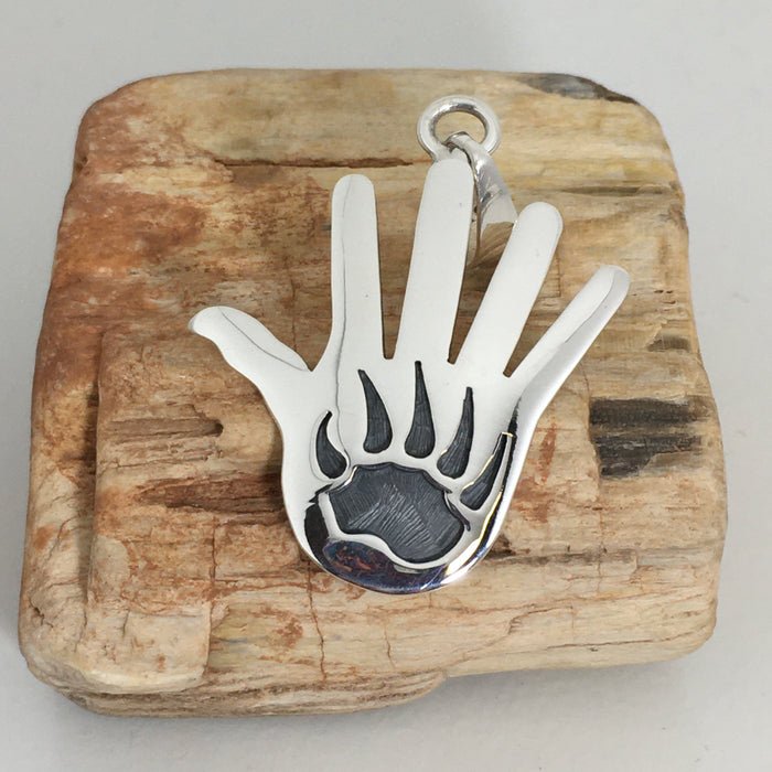 Hopi Silver Overlay Hand and Bear Paw Pendant, by Merle Namoki
