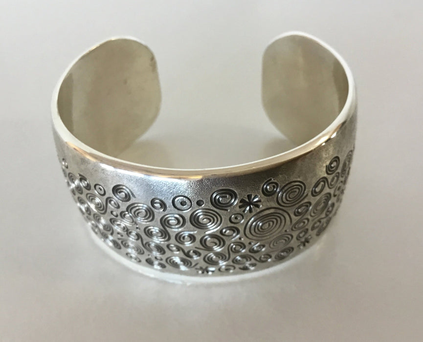 Spirals Stamped Silver Bracelet, by Norbert Peshlaki