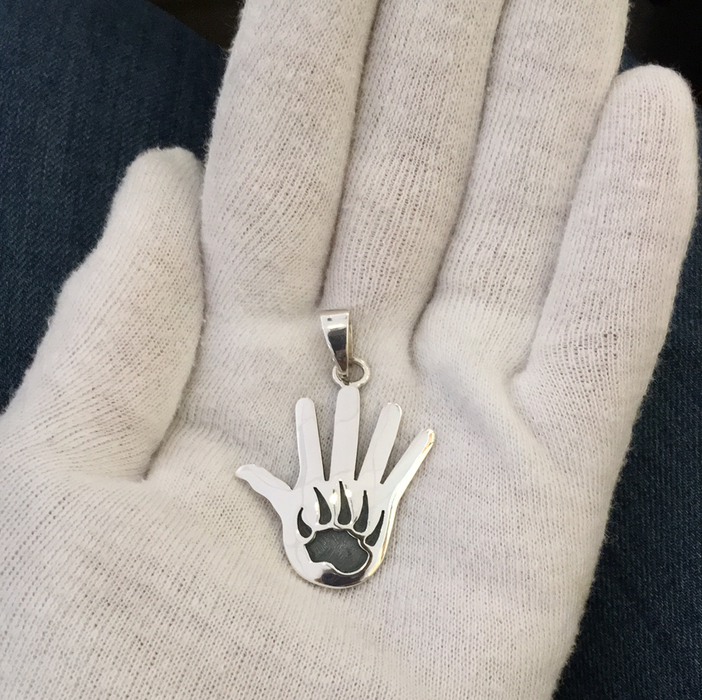 Hopi Silver Overlay Hand and Bear Paw Pendant, by Merle Namoki