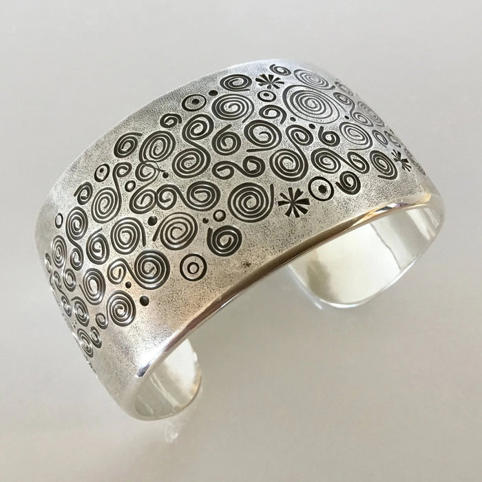 Spirals Stamped Silver Bracelet, by Norbert Peshlaki