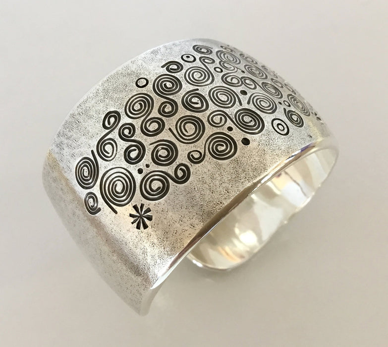 Spirals Stamped Silver Bracelet, by Norbert Peshlaki