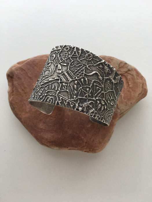 Hopi Petroglyphs Tufa Cast Bracelet, by Antone Honanie