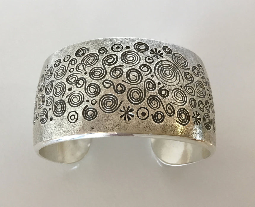 Spirals Stamped Silver Bracelet, by Norbert Peshlaki